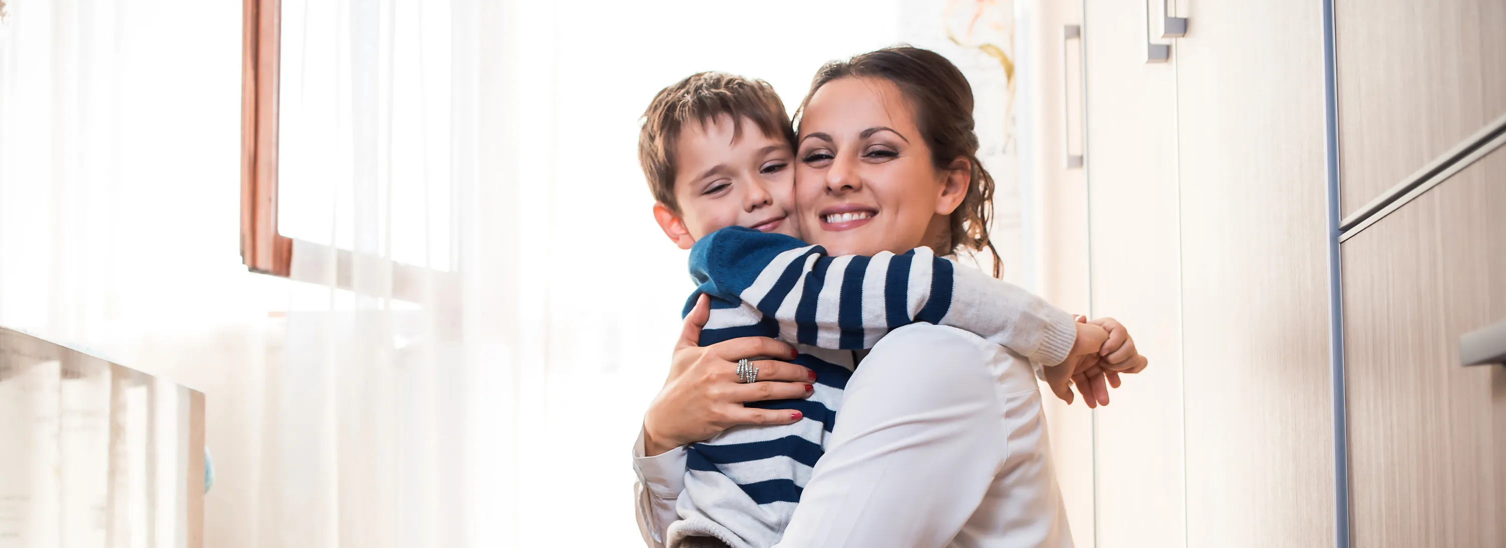a woman holding a child in her arms