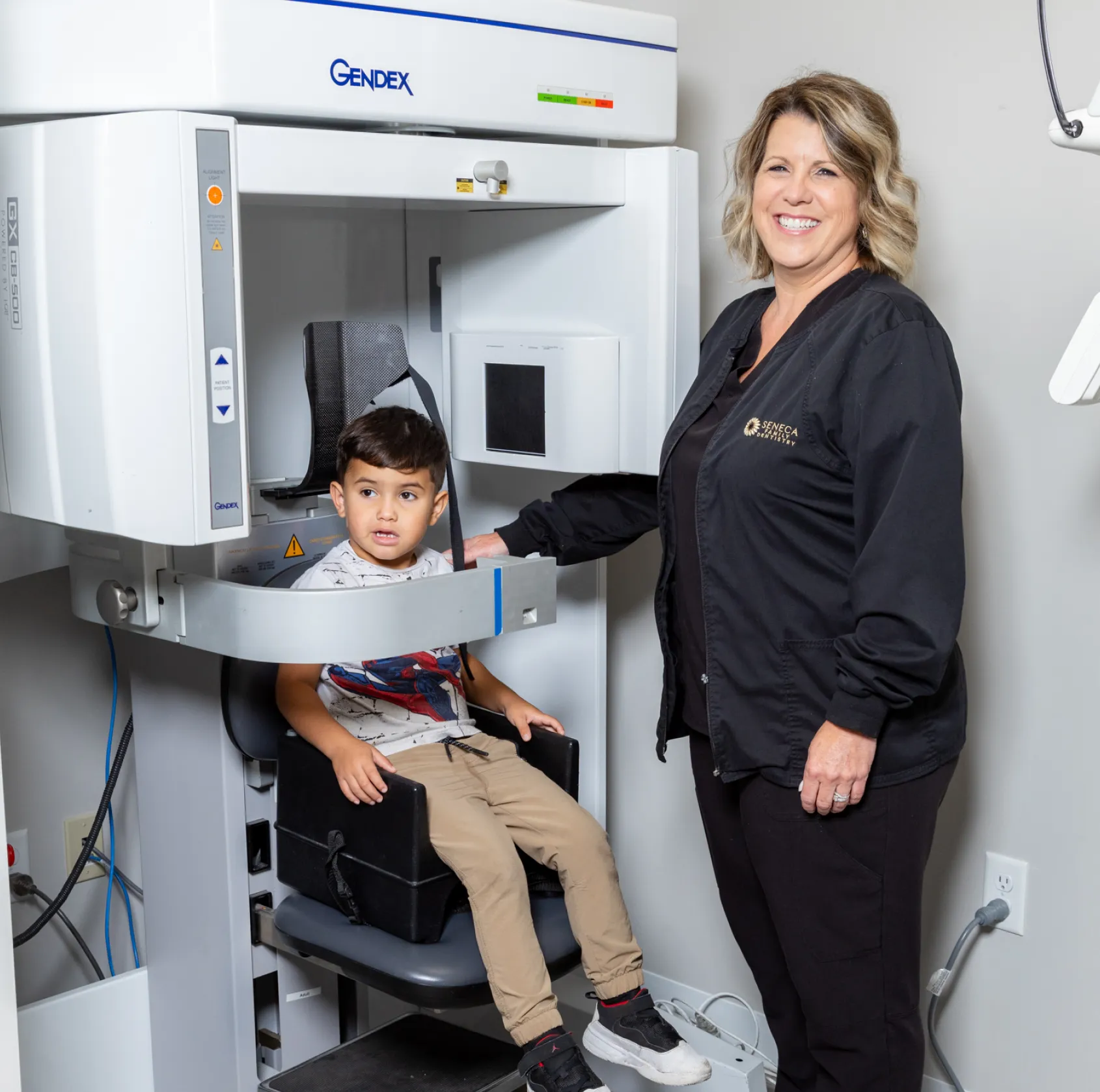 a woman standing next to a child in a machine