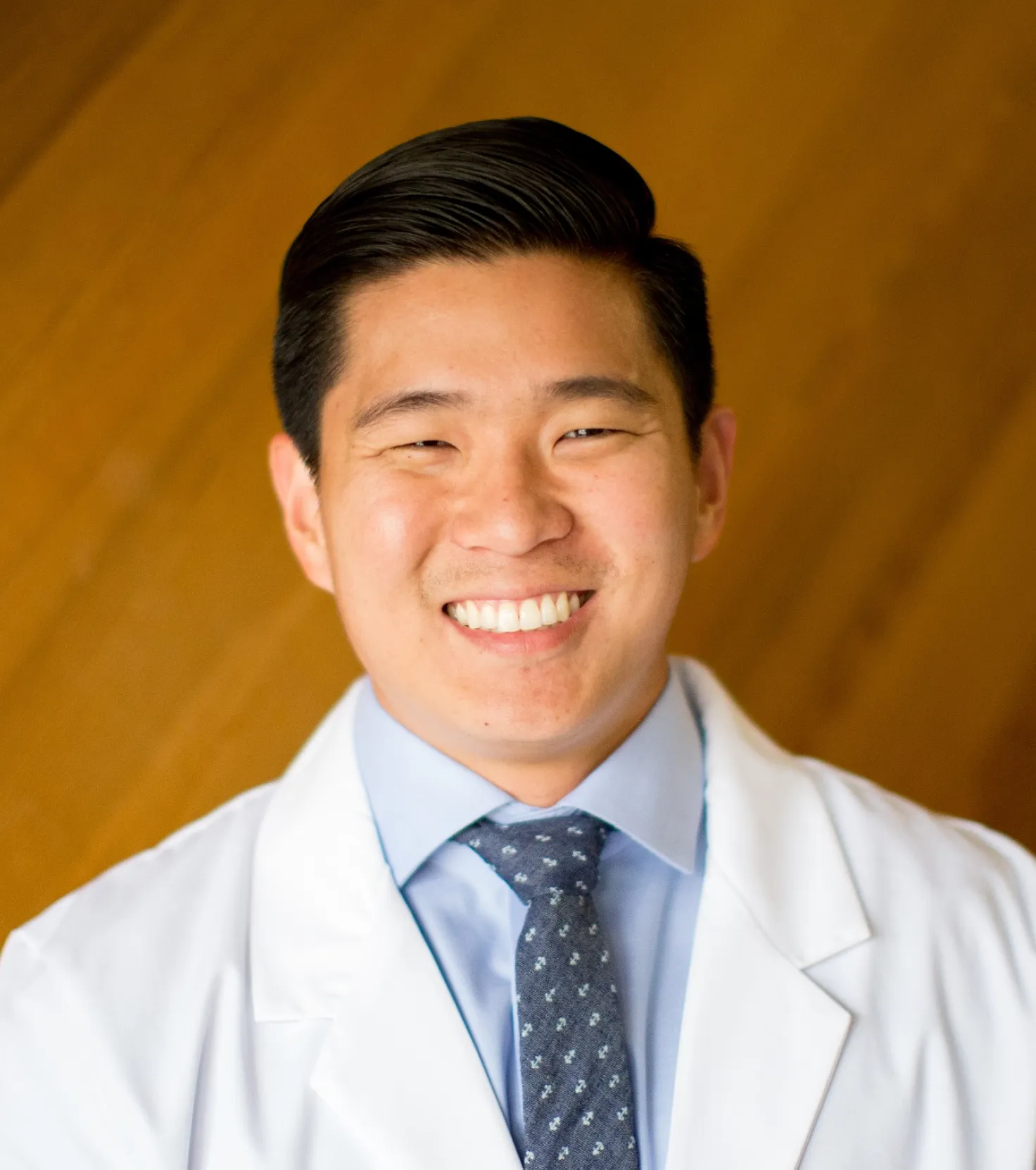 DR. TRAVIS TANAKA