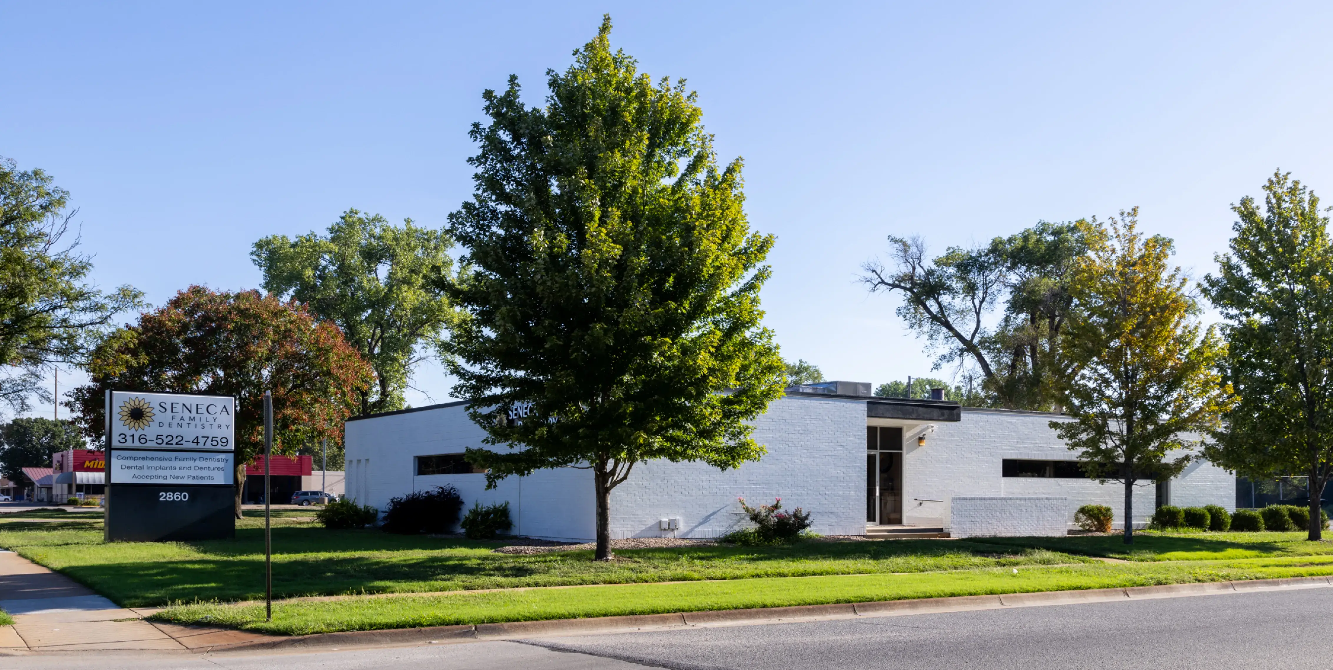 a white building with a sign in front of it