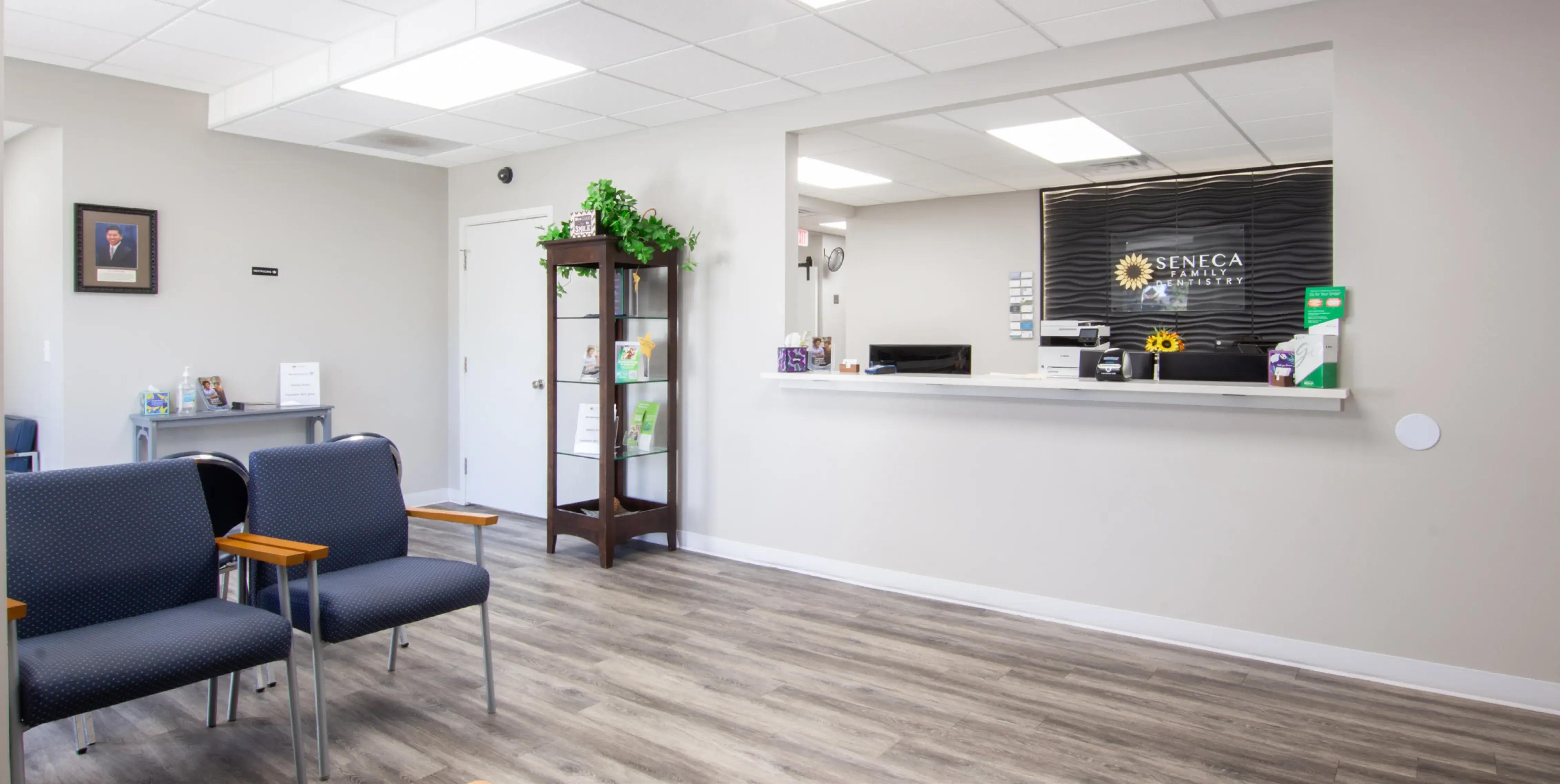 a waiting room with chairs and a counter