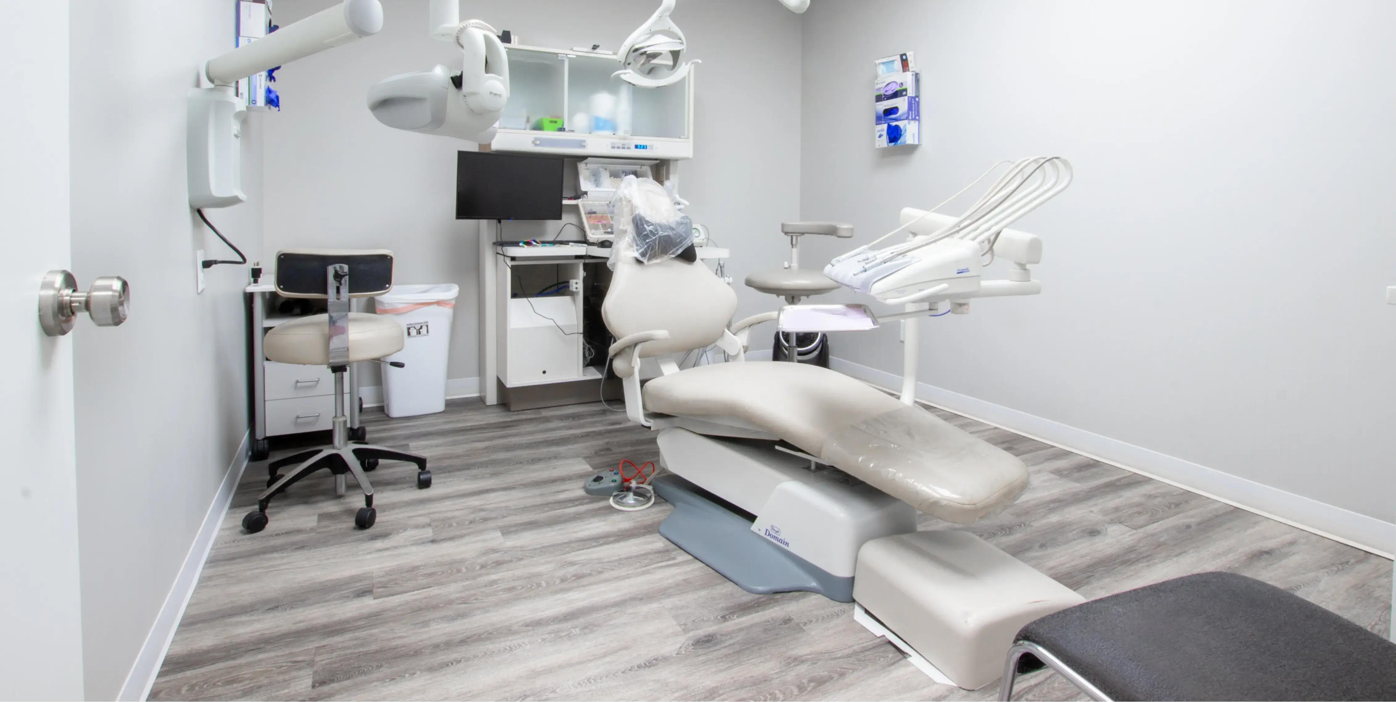 a dental office with a chair and desk