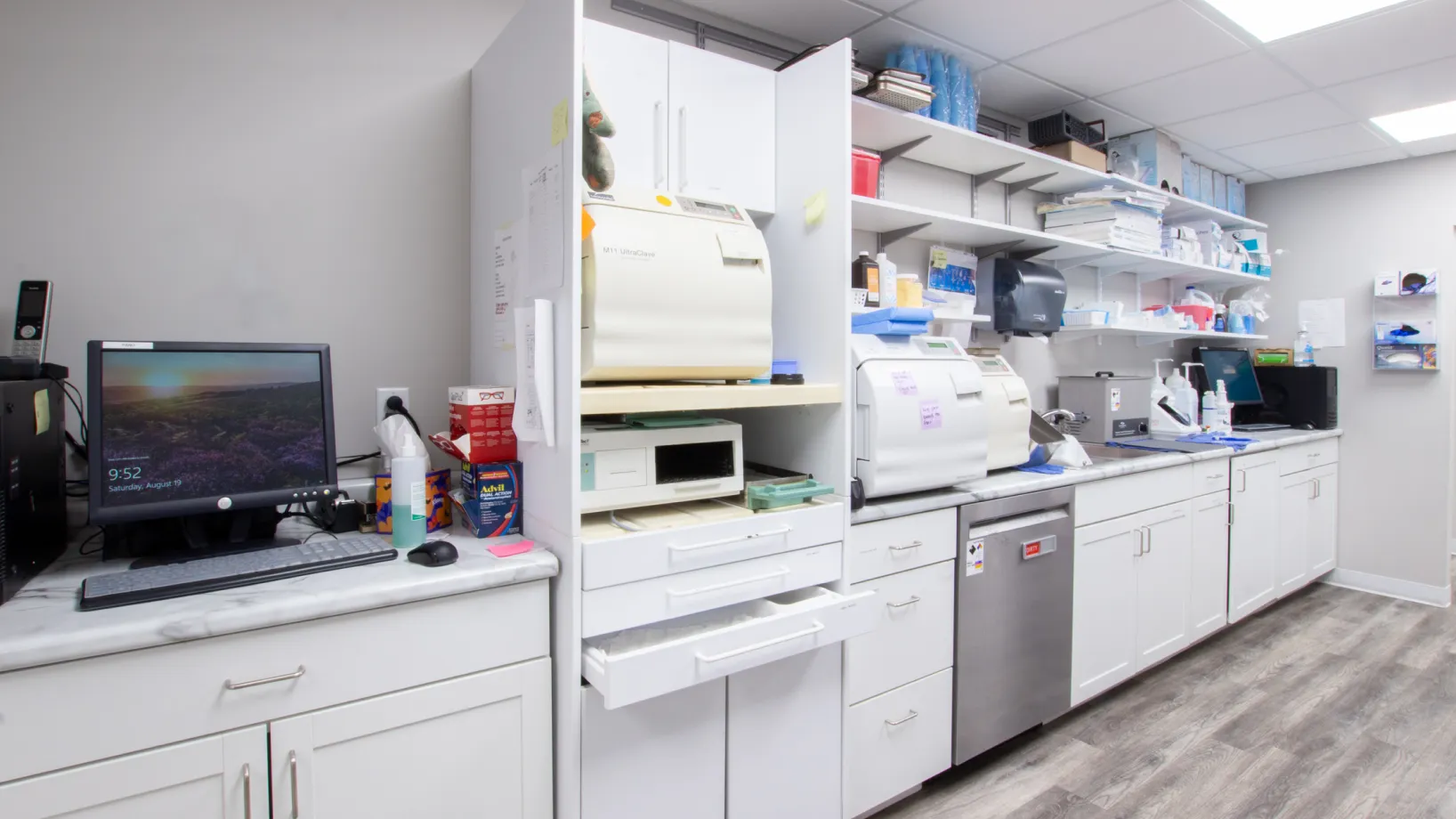 a lab with a computer, printer, and other equipment