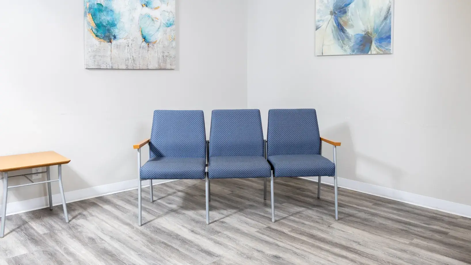 a couple of blue chairs sitting next to each other